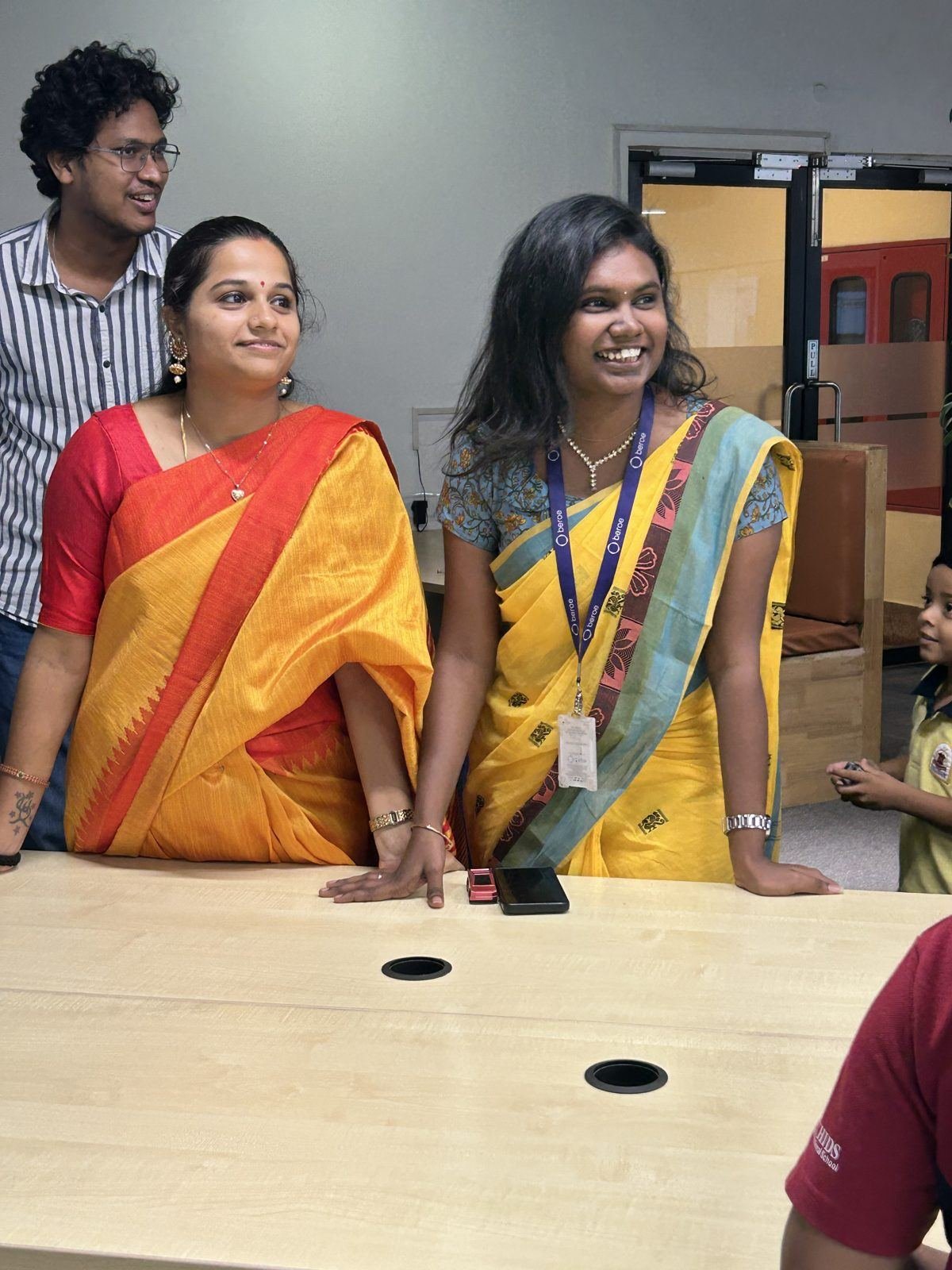 Two colleagues smiling at the action