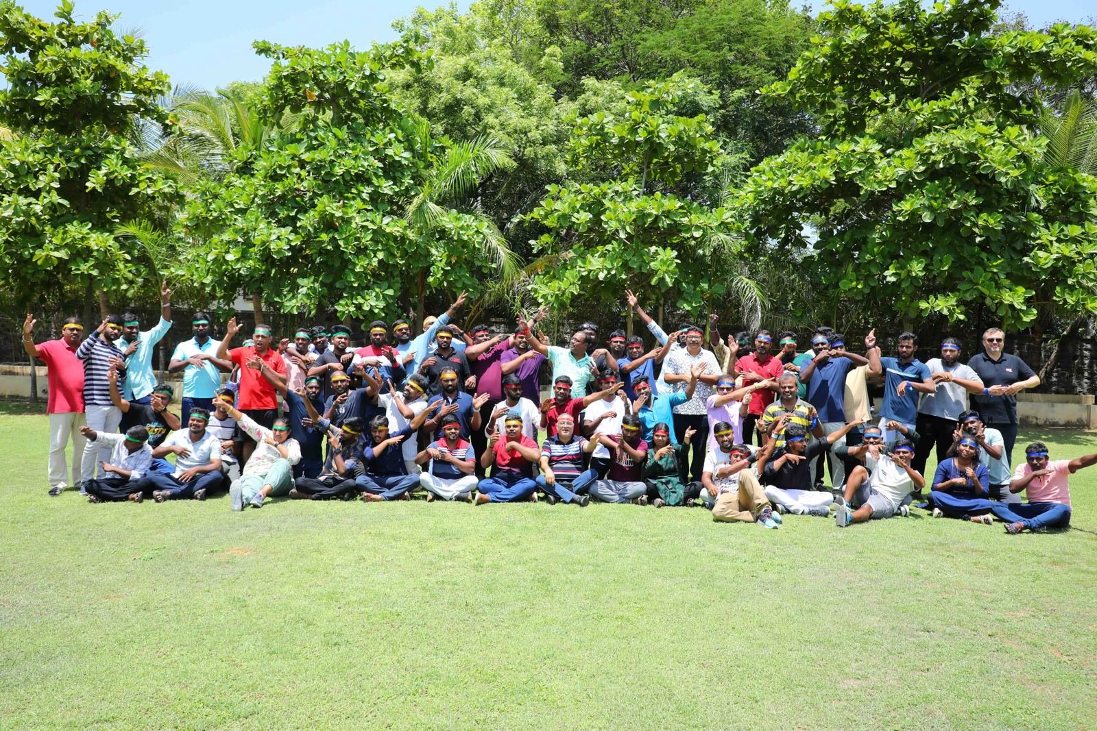 The CE+T Power team cheering together on the lawn