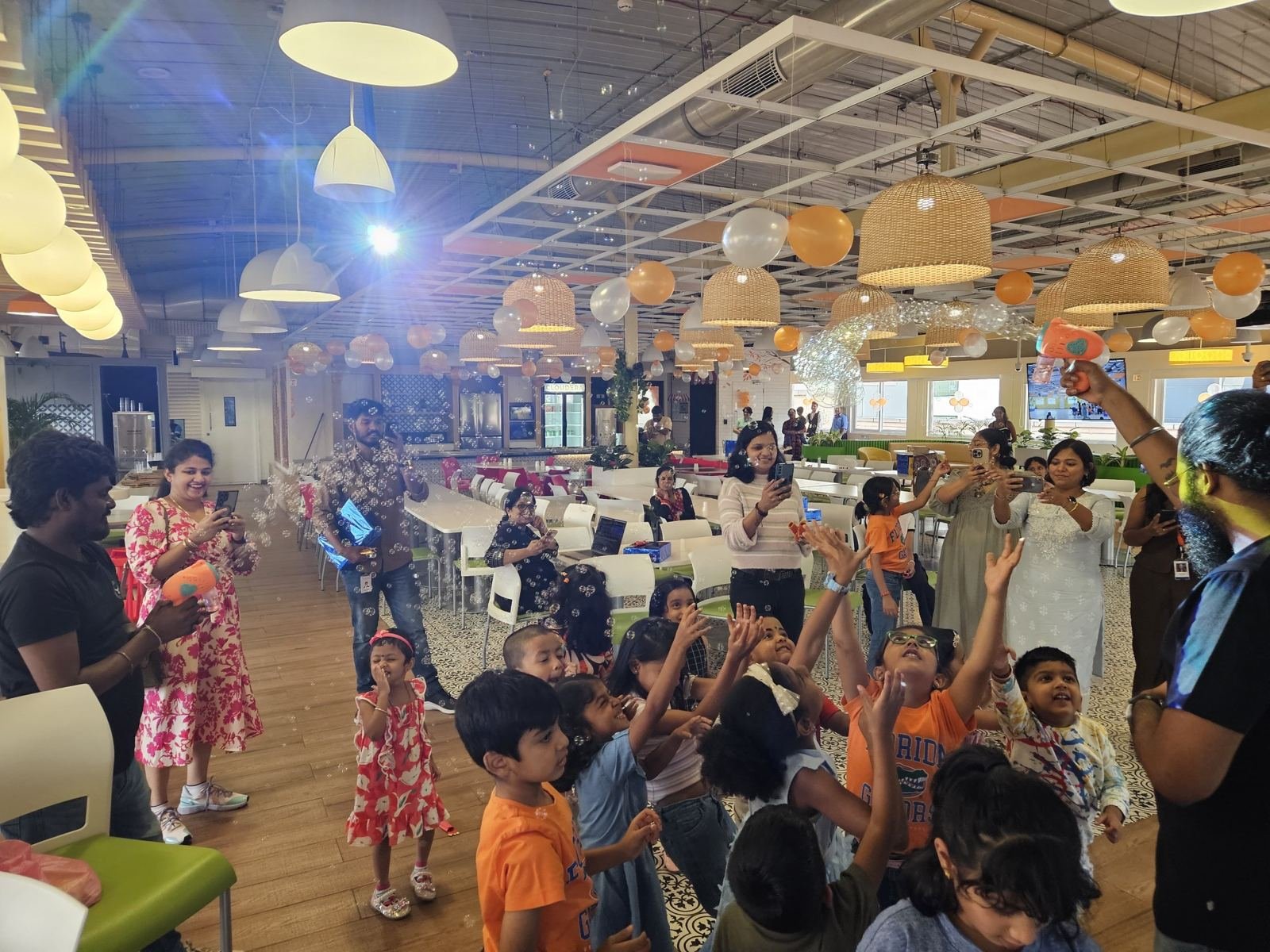 Children reaching for bubbles at the Cloudera Summer Camp