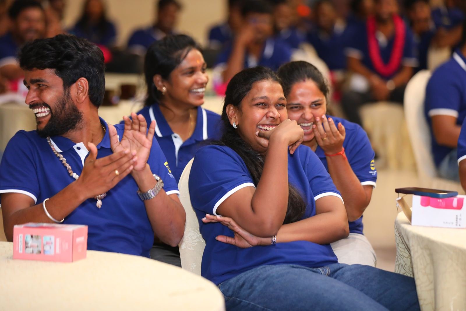 HARTING colleagues laughing and clapping together