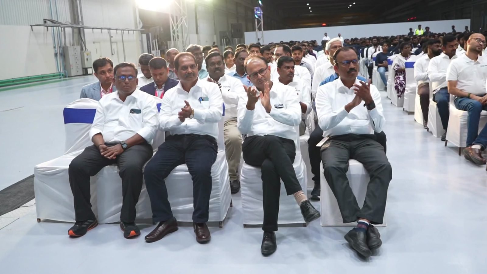 Colleagues applauding in the front row