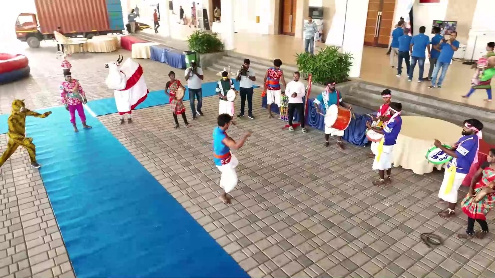 Folk dancers and drummers welcoming Vestas colleagues