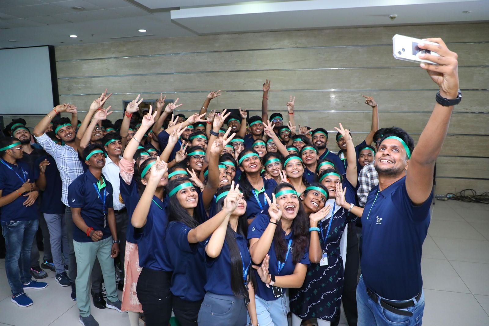 A whole team crowding into one big selfie